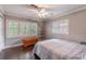 Cozy bedroom with hardwood floors, ceiling fan and large windows with plantation shutters at 212 Blossom Ln, Winter Park, FL 32789