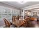 Inviting dining room features wood floors, bright windows, and wood furniture at 212 Blossom Ln, Winter Park, FL 32789