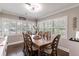 Bright dining room features wood floors, bright windows, and wood furniture at 212 Blossom Ln, Winter Park, FL 32789