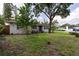 Single story home featuring a well-maintained front lawn, mature trees, and a stone pathway to the front door at 212 Blossom Ln, Winter Park, FL 32789