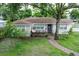 Charming single-story home with a brick pathway and beautiful lawn at 212 Blossom Ln, Winter Park, FL 32789