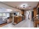 Open kitchen features pendant lighting, wooden cabinetry, and an island with barstool seating at 212 Blossom Ln, Winter Park, FL 32789