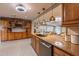 Updated kitchen featuring granite counters, stainless steel appliances, and pendant lighting at 212 Blossom Ln, Winter Park, FL 32789