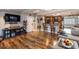 Open concept living room flows into the kitchen and features stylish wood flooring at 212 Blossom Ln, Winter Park, FL 32789