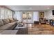 Bright living room with hardwood floors, French doors, and comfortable seating at 212 Blossom Ln, Winter Park, FL 32789