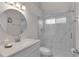 Bathroom with a granite countertop vanity and a glass-enclosed walk-in shower at 24954 Navel Ave, Leesburg, FL 34748