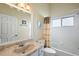 Bright bathroom features a tub and shower combination, updated fixtures, and a neutral color palette at 26034 Oakmount Dr, Leesburg, FL 34748