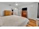Spacious bedroom with wood floors and a view of the connected bathroom at 2743 Nattie Ct, Orlando, FL 32826