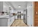 Modern kitchen with stainless steel appliances, granite countertops, and white cabinetry at 2743 Nattie Ct, Orlando, FL 32826