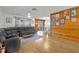 Open living area with hardwood floors, comfortable seating, and seamless flow to the kitchen at 2743 Nattie Ct, Orlando, FL 32826
