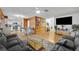Open-concept living space with a view of the kitchen and dining area for modern living at 2743 Nattie Ct, Orlando, FL 32826