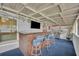 Covered patio with bar and tv, ideal for outdoor entertaining at 2743 Nattie Ct, Orlando, FL 32826
