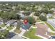 Aerial view of the home in a neighborhood setting with mature trees and well-kept lawns at 2849 Doe Run Trl, Orange City, FL 32763