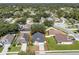 Aerial view of a lovely residential home with a defined property line in a green neighborhood at 2849 Doe Run Trl, Orange City, FL 32763
