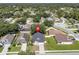 Aerial view of the home in a neighborhood setting with mature trees and well-kept lawns at 2849 Doe Run Trl, Orange City, FL 32763