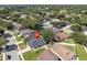Aerial view of the home in a neighborhood setting with mature trees and well-kept lawns at 2849 Doe Run Trl, Orange City, FL 32763