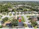 An aerial view displays this home's positioning in a well-maintained neighborhood with mature trees at 2849 Doe Run Trl, Orange City, FL 32763