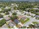 An aerial view shows the location of the house on a large lot in a well-manicured neighborhood at 2849 Doe Run Trl, Orange City, FL 32763