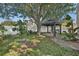 Expansive backyard featuring a gazebo, mature trees, and lush landscaping at 2849 Doe Run Trl, Orange City, FL 32763
