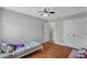 Bedroom with a bed, hardwood floors, closet, ceiling fan, and vanity at 2849 Doe Run Trl, Orange City, FL 32763