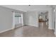 Open dining room with tile floors, neutral paint, and natural light, providing an inviting space for gatherings at 2849 Doe Run Trl, Orange City, FL 32763