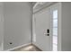 Welcoming foyer with tiled floors and a bright white front door with sidelights at 2849 Doe Run Trl, Orange City, FL 32763