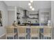 Stylish kitchen featuring a stainless steel oven and a range hood, complemented by sleek countertops and ample storage at 2849 Doe Run Trl, Orange City, FL 32763