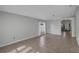 Bright and spacious living room featuring tile flooring, neutral paint, and ample natural light at 2849 Doe Run Trl, Orange City, FL 32763