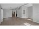 Open-concept living room featuring tile floors, arched doorways, and neutral color palette at 2849 Doe Run Trl, Orange City, FL 32763