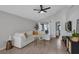 Comfortable living room featuring a large white sofa and neutral decor at 2849 Doe Run Trl, Orange City, FL 32763