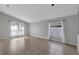 Bright living room featuring neutral walls, tile floors, and large windows that let in lots of natural light at 2849 Doe Run Trl, Orange City, FL 32763