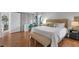 Beautifully staged main bedroom with accent furniture and neutral color palette at 2849 Doe Run Trl, Orange City, FL 32763