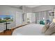 Inviting main bedroom featuring a large bed and an en-suite bathroom at 2849 Doe Run Trl, Orange City, FL 32763