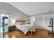 Bright main bedroom with wood floors, neutral colors, and ample natural light at 2849 Doe Run Trl, Orange City, FL 32763