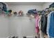 Spacious walk-in closet with shelving offering ample storage for clothes, shoes, and accessories at 2849 Doe Run Trl, Orange City, FL 32763