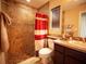 Inviting bathroom featuring a tiled walk-in shower and a vanity with decorative touches for a spa-like experience at 29222 Can Do Ln, Tavares, FL 32778