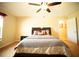 Cozy bedroom featuring large bed, and ceiling fan at 29222 Can Do Ln, Tavares, FL 32778