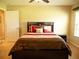 Comfortable bedroom featuring a ceiling fan, neutral walls, and coordinated bedding for a relaxing retreat at 29222 Can Do Ln, Tavares, FL 32778