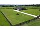 Expansive home showcasing a meticulously maintained lawn and a long driveway at 29222 Can Do Ln, Tavares, FL 32778