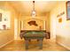 Spacious game room featuring a pool table, stylish decor, and ample lighting at 29222 Can Do Ln, Tavares, FL 32778