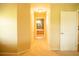 Hallway view of primary bathroom featuring a tub, separate shower, and tile flooring at 29222 Can Do Ln, Tavares, FL 32778