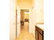 The hallway seamlessly connects the laundry area with the dining space beyond at 29222 Can Do Ln, Tavares, FL 32778