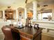 Well-appointed office space with desk, leather chair, and views of the open-concept living area at 29222 Can Do Ln, Tavares, FL 32778