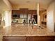 Well-equipped kitchen featuring granite counters, stainless steel appliances, and ample cabinet space at 29222 Can Do Ln, Tavares, FL 32778