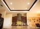 Modern kitchen featuring granite countertops, stainless steel appliances, and dark wood cabinetry at 29222 Can Do Ln, Tavares, FL 32778
