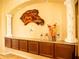 A living room with brown cabinets, columns, and a granite countertop adds architectural detail at 29222 Can Do Ln, Tavares, FL 32778
