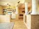 Open living space featuring tile floors, decorative columns, and an arched entryway at 29222 Can Do Ln, Tavares, FL 32778