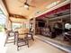 Transition from the covered patio to the living area through sliding glass doors at 29222 Can Do Ln, Tavares, FL 32778