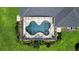Aerial view of screened-in pool area featuring uniquely shaped design and lush landscaping at 29222 Can Do Ln, Tavares, FL 32778