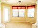 Light-filled sitting area features decorative columns, sunlit windows, and a glass door at 29222 Can Do Ln, Tavares, FL 32778